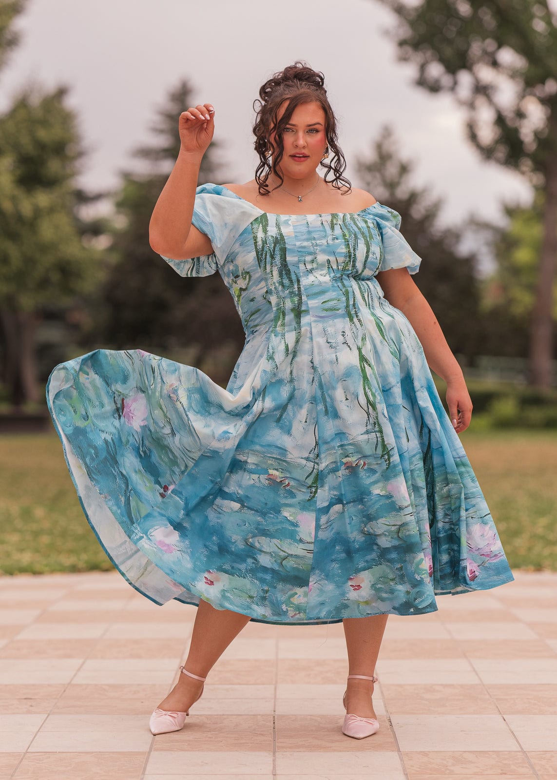 chic size inclusive model wearing JessaKae Water Lily Dress