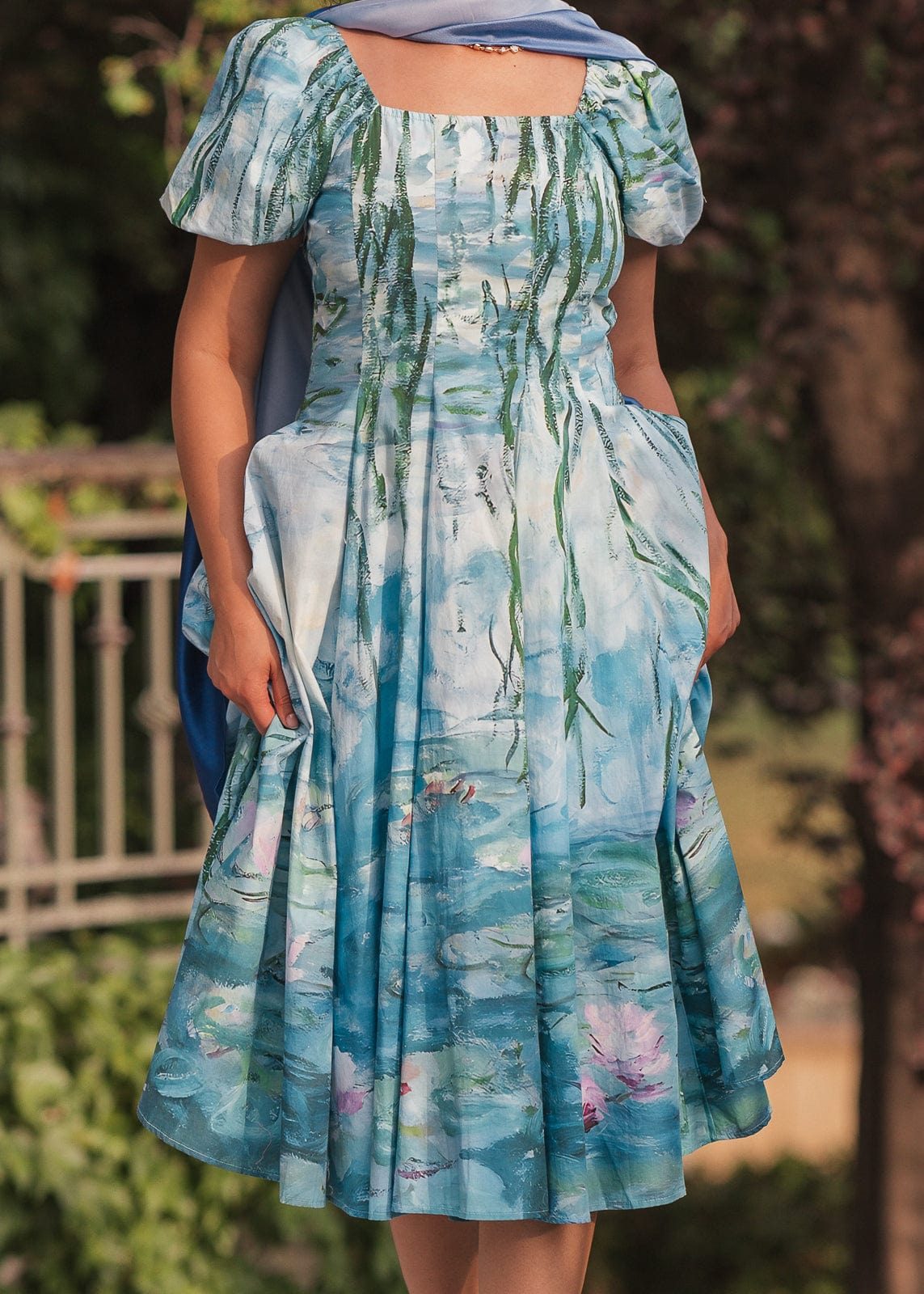 chic size inclusive model wearing JessaKae Water Lily Dress