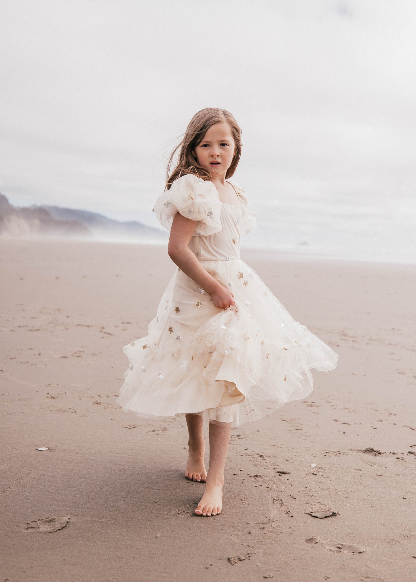 chic size inclusive model wearing JessaKae Wendy Girls Dress_North Star / 12-18M Girls Dress