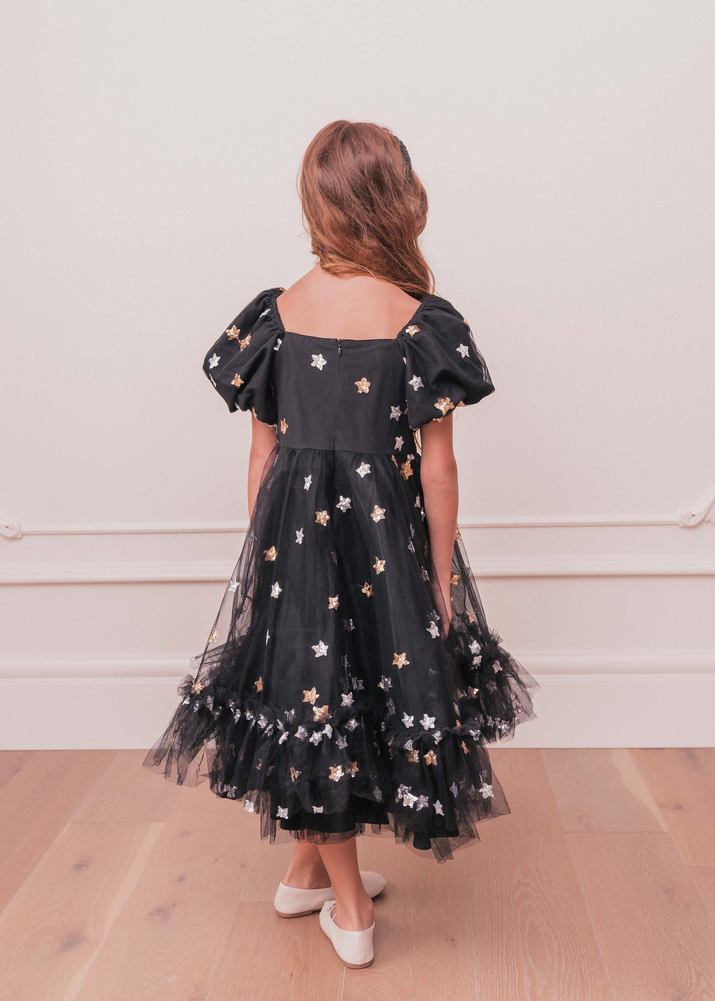 chic size inclusive model wearing JessaKae Wendy Girls Dress_Black Star / 12-14Y Girls Dress