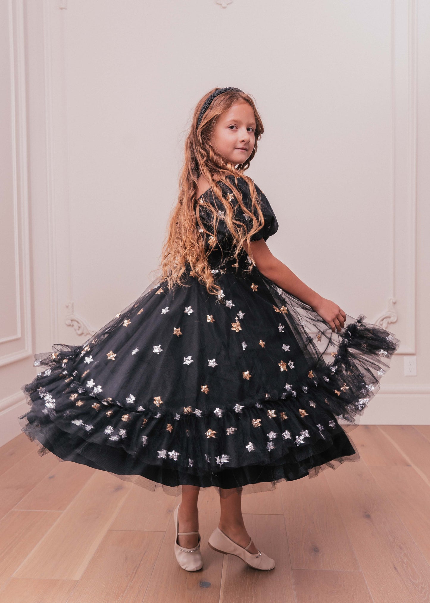 chic size inclusive model wearing JessaKae Wendy Girls Dress_Black Star / 10-12Y Girls Dress