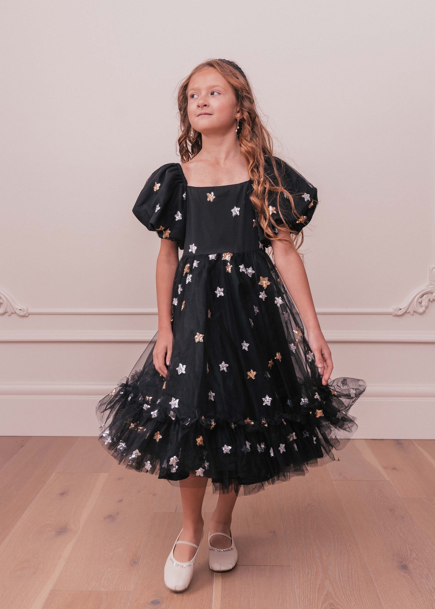 chic size inclusive model wearing JessaKae Wendy Girls Dress_Black Star / 4-5Y Girls Dress