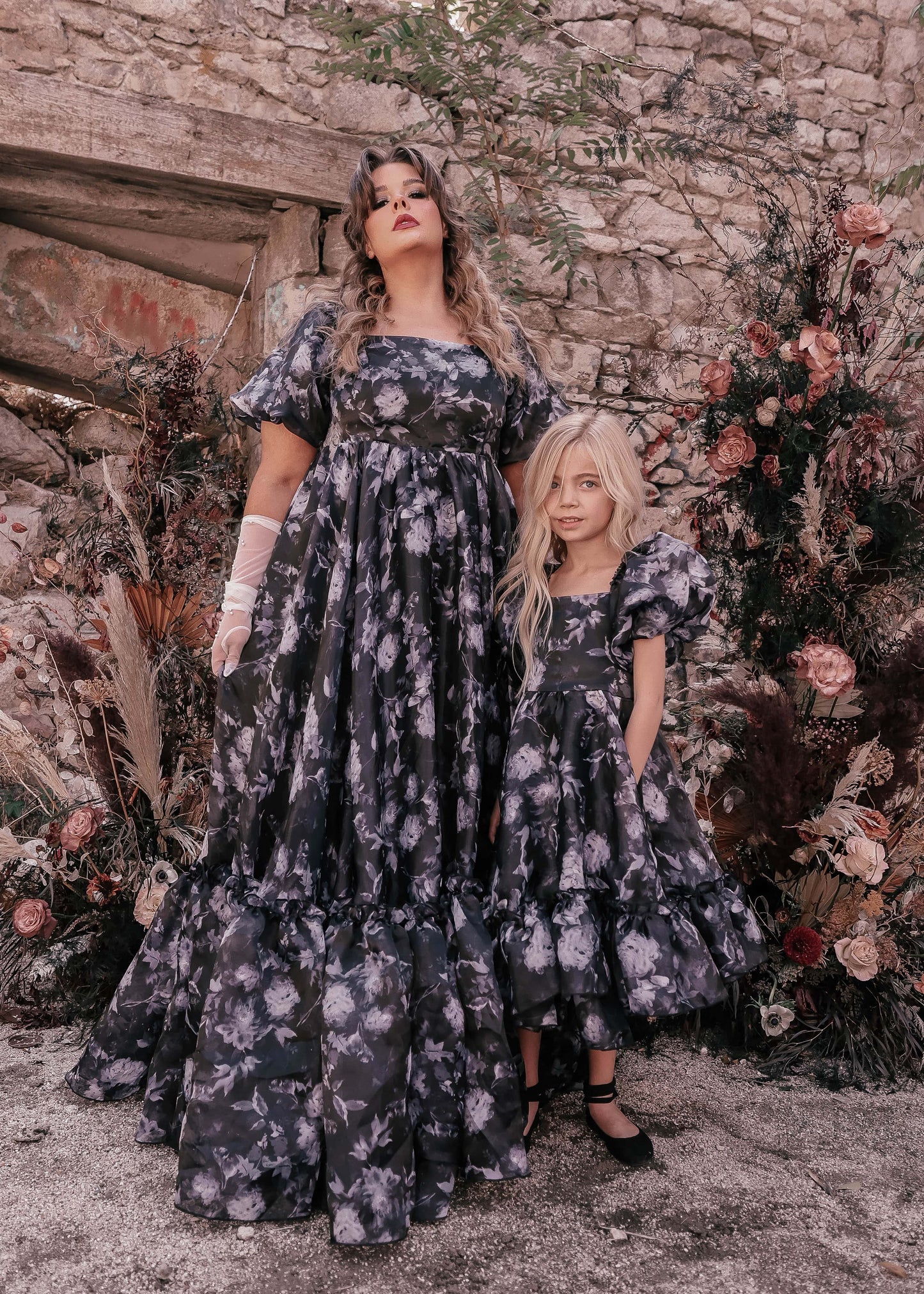 chic size inclusive model wearing JessaKae Wendy Girls Dress_Black Floral / 10-12Y Girls Dress