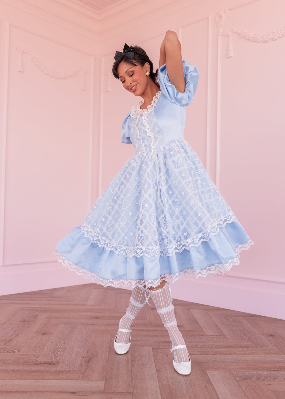 chic size inclusive model wearing JessaKae Wonderland Dress