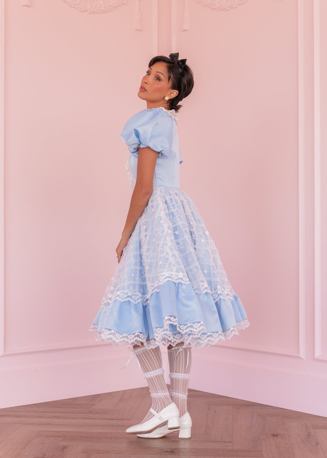 chic size inclusive model wearing JessaKae Wonderland Dress