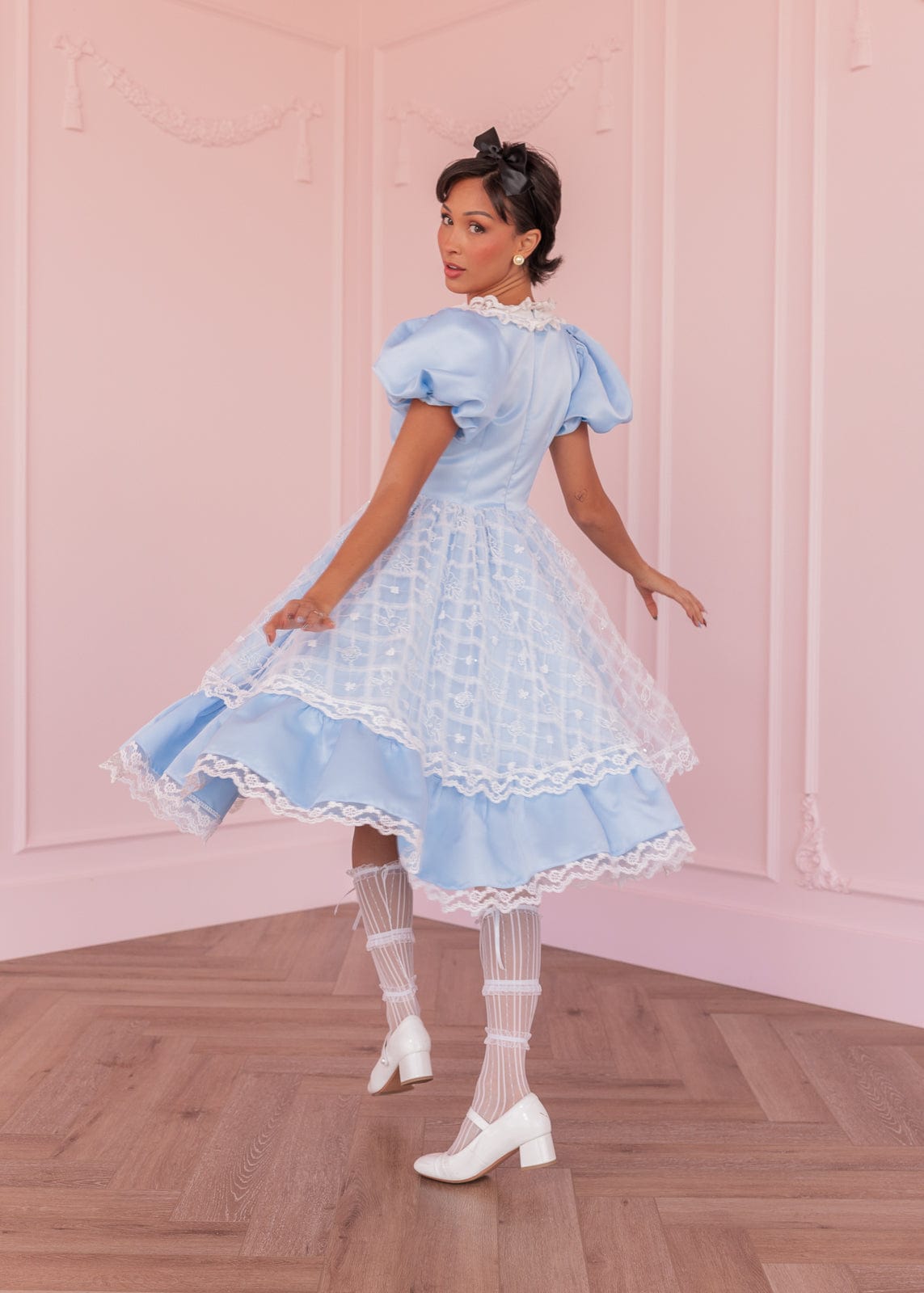 chic size inclusive model wearing JessaKae Wonderland Dress