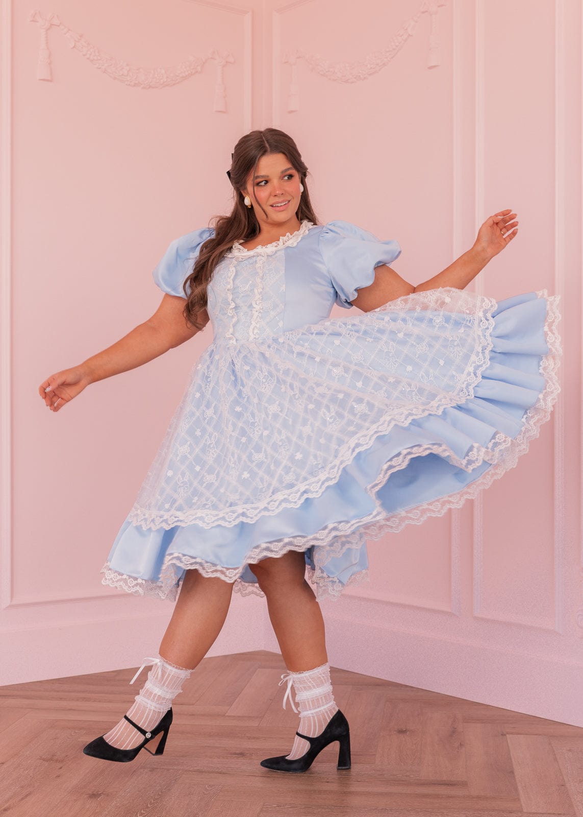 chic size inclusive model wearing JessaKae Wonderland Dress