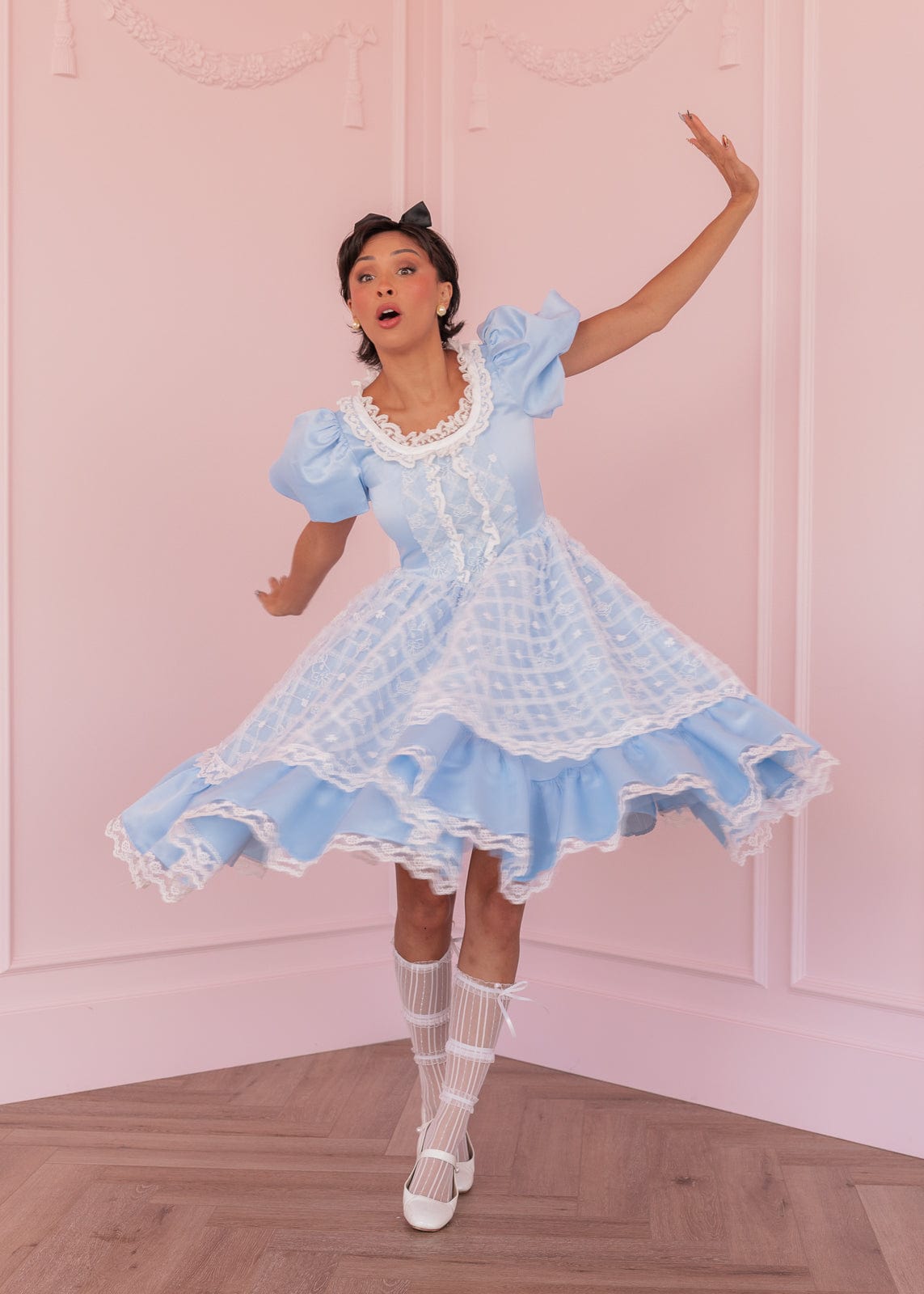 chic size inclusive model wearing JessaKae Wonderland Dress