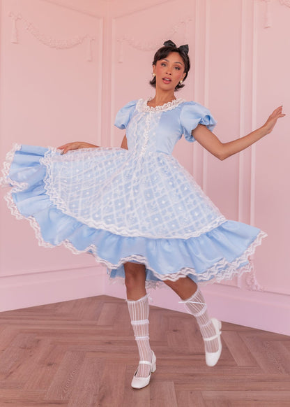 chic size inclusive model wearing JessaKae Wonderland Dress