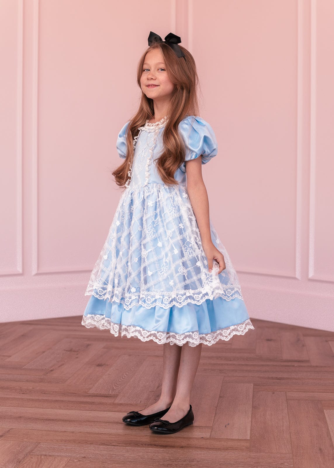 chic size inclusive model wearing JessaKae Wonderland Girls Dress