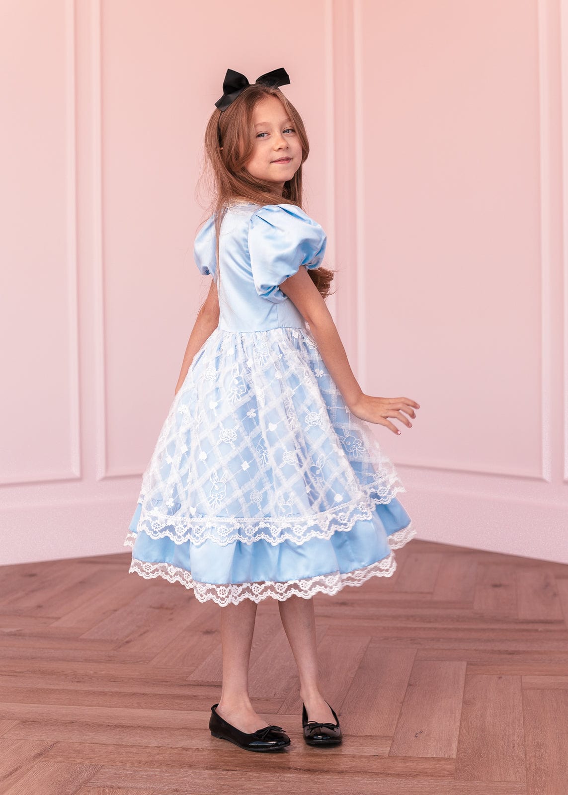 chic size inclusive model wearing JessaKae Wonderland Girls Dress