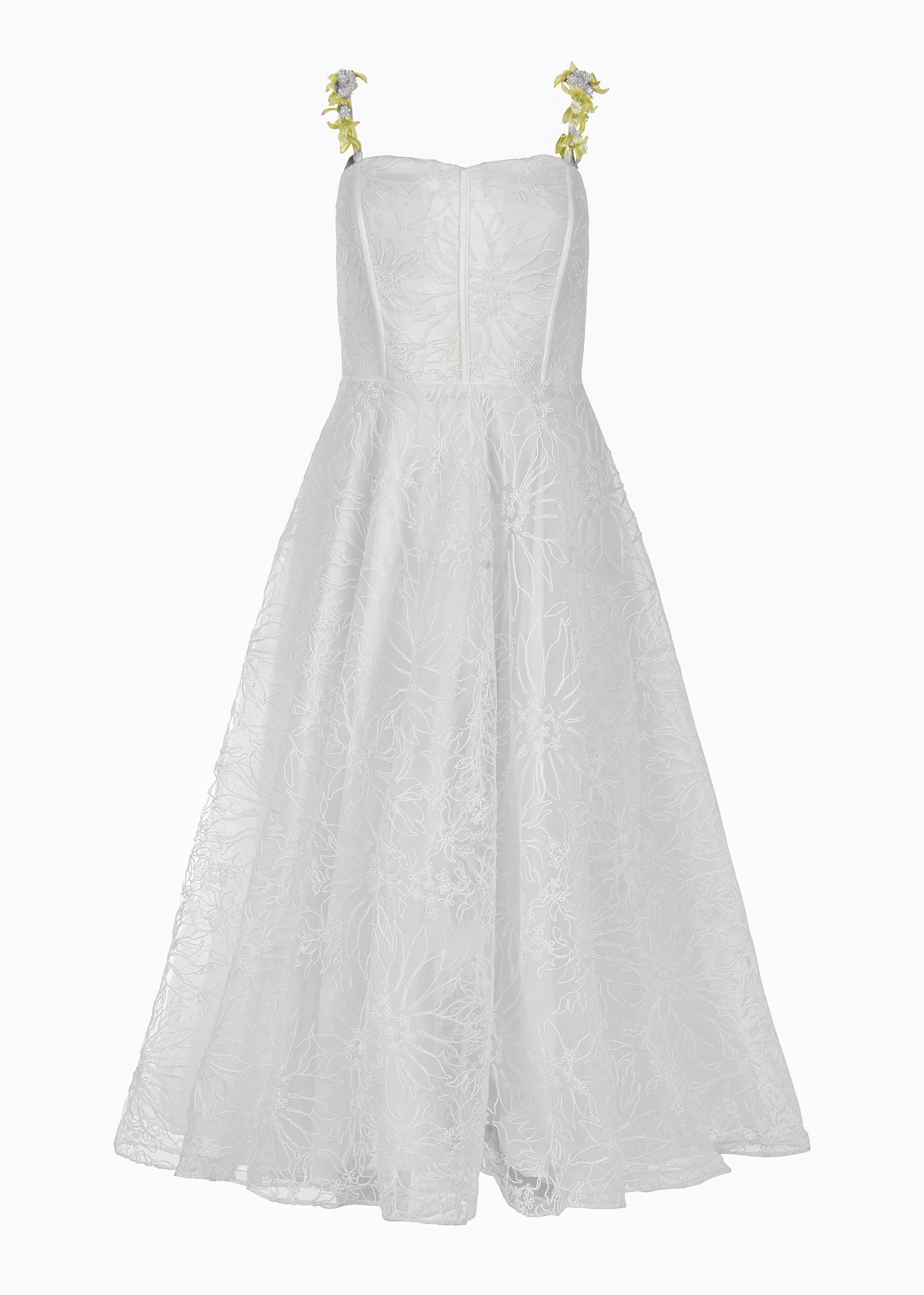 White strapless dress with floral straps and textured fabric, full skirt and fitted bodice, on a plain background.