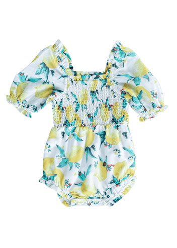 chic size inclusive model wearing JessaKae Limon Baby Romper_White / 0-3M Baby Romper