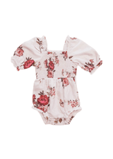 chic size inclusive model wearing JessaKae Wild Rose Baby Romper Blush / 0-3M Baby Romper